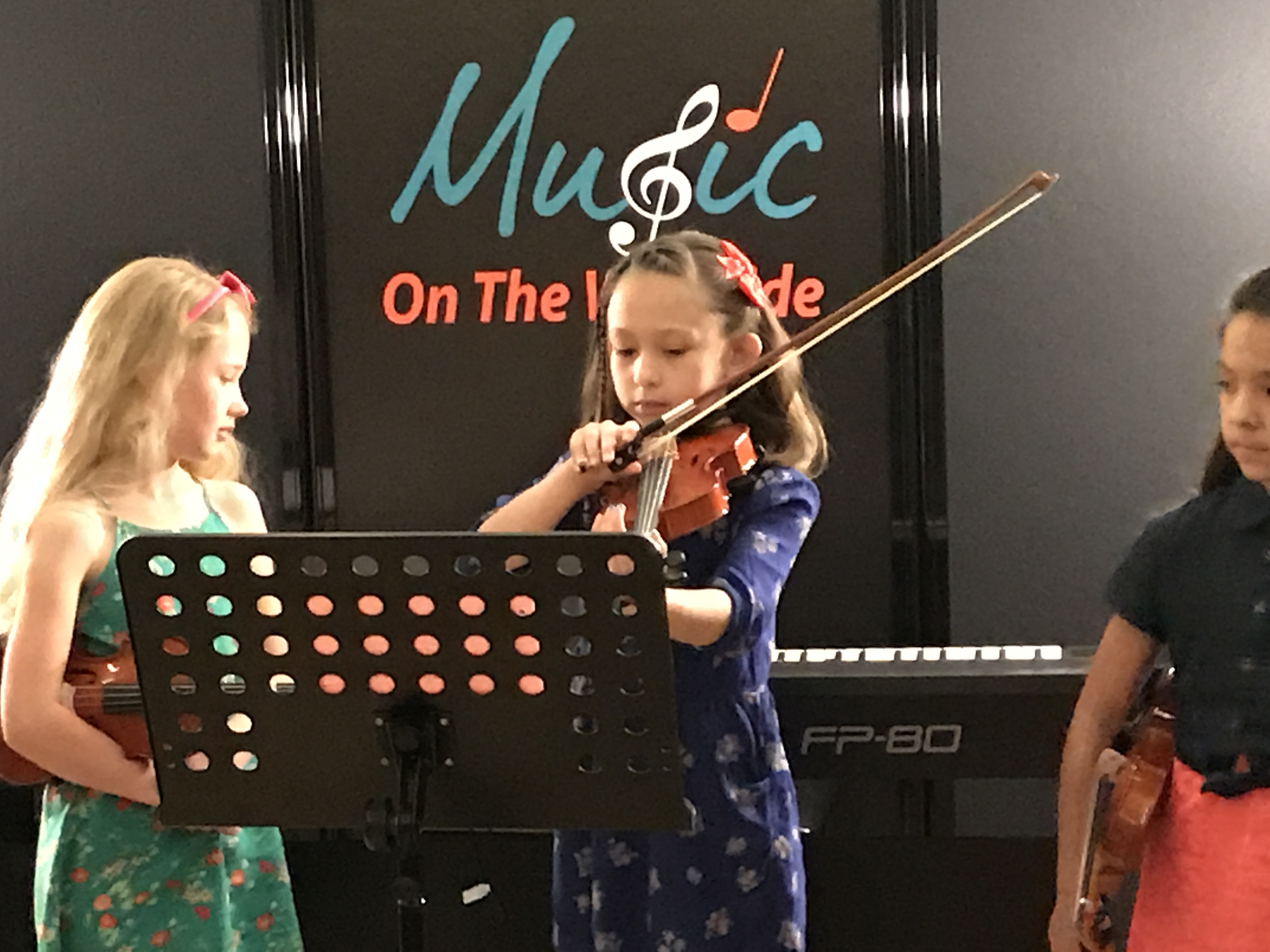 Violin student at Music on the Westside studio